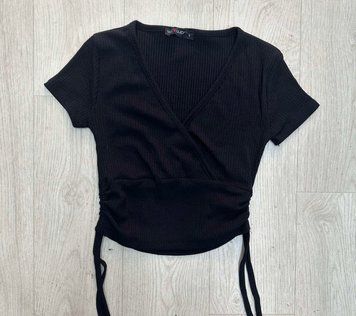 Коротка жіноча футболка із затяжками S-L VN 91642 фото